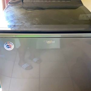 Grey and black whirlpool digital washer and dryer